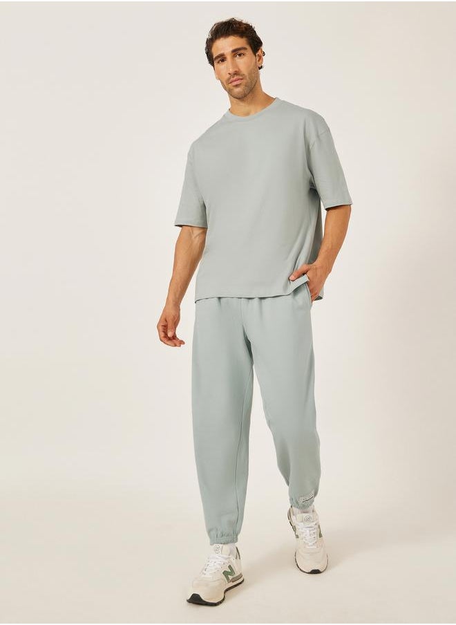 Mid Rise Relaxed Fit Joggers with Badge Detail
