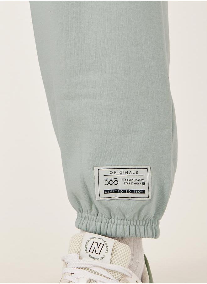Mid Rise Relaxed Fit Joggers with Badge Detail