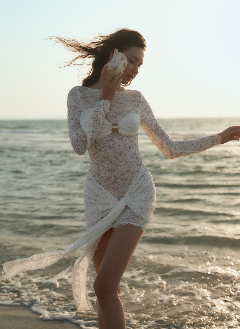 Guipure mini dress with draped neckline and golden decor