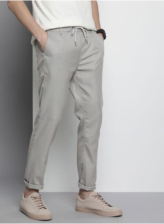 Men Regular Fit Self Design Mid-Rise Stretchable Jogger Trousers