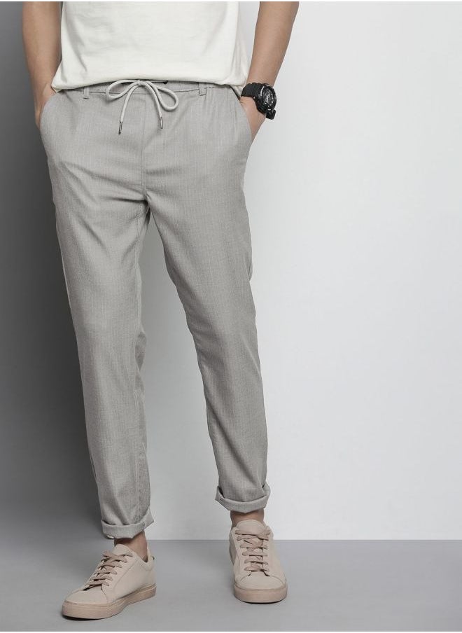 Men Regular Fit Self Design Mid-Rise Stretchable Jogger Trousers