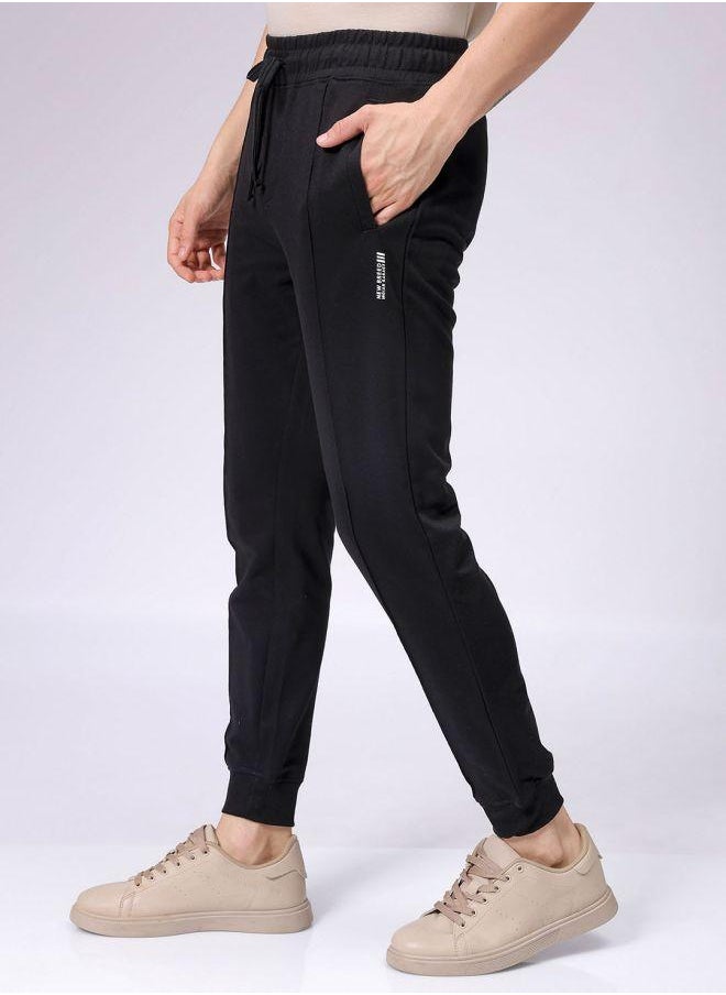 Men Slim Fit Solid Mid-Rise Stretchable Knitted Jogger Trousers