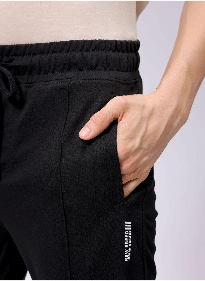 Men Slim Fit Solid Mid-Rise Stretchable Knitted Jogger Trousers