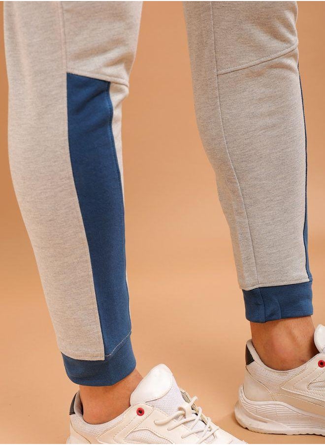 Men Slim Fit Solid Mid-Rise Stretchable Knitted Jogger Trousers