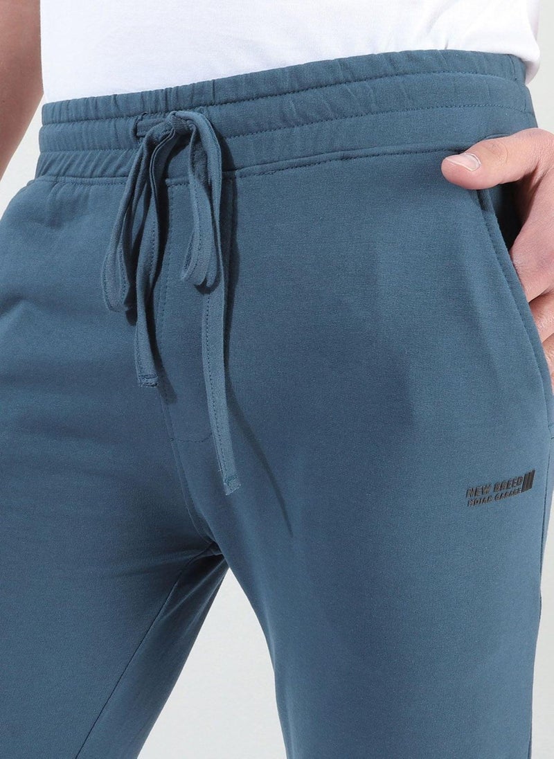 Men Slim Fit Solid Mid-Rise Stretchable Knitted Jogger Trousers