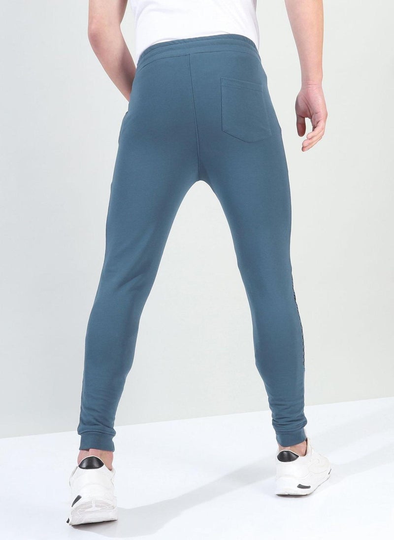 Men Slim Fit Solid Mid-Rise Stretchable Knitted Jogger Trousers