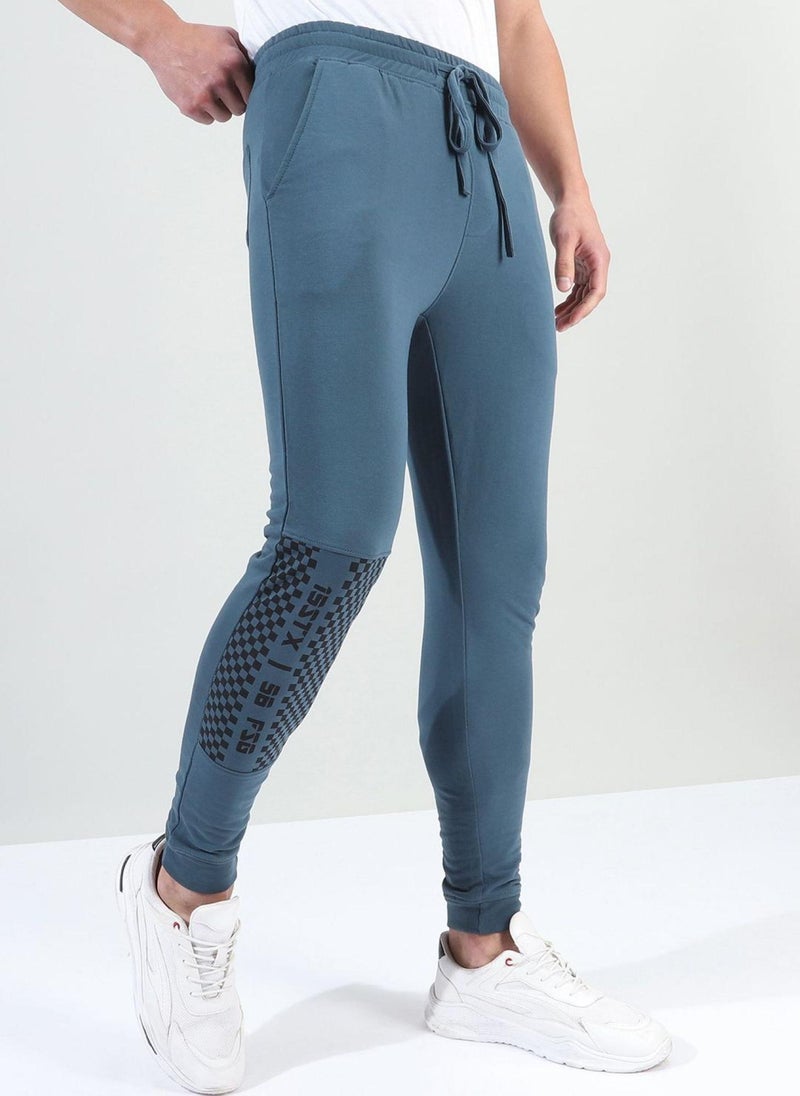 Men Slim Fit Solid Mid-Rise Stretchable Knitted Jogger Trousers