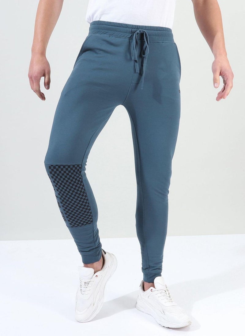 Men Slim Fit Solid Mid-Rise Stretchable Knitted Jogger Trousers