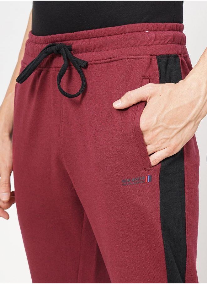 Men Slim Fit Solid Mid-Rise Stretchable Knitted Jogger Trousers