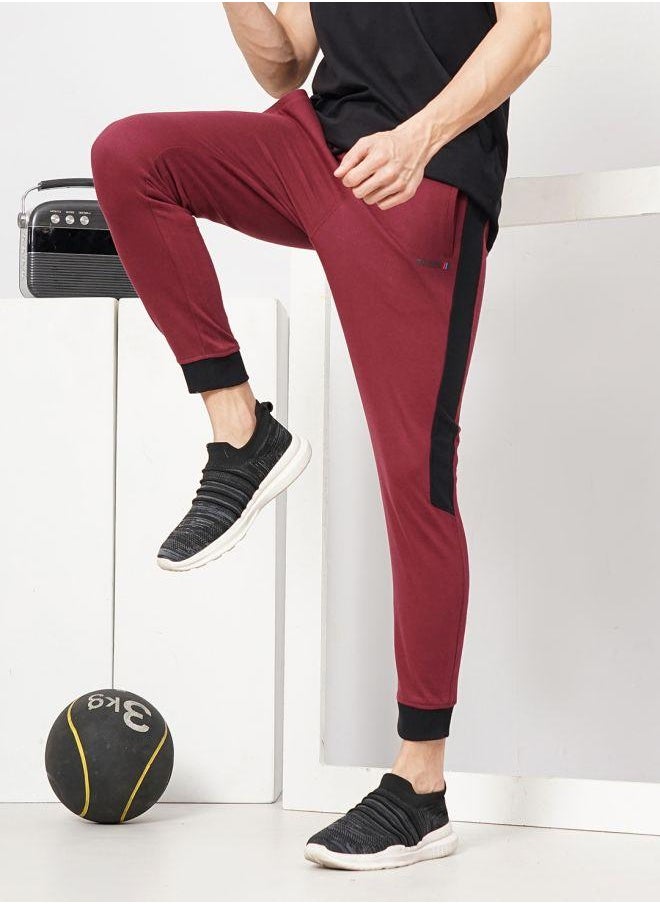 Men Slim Fit Solid Mid-Rise Stretchable Knitted Jogger Trousers