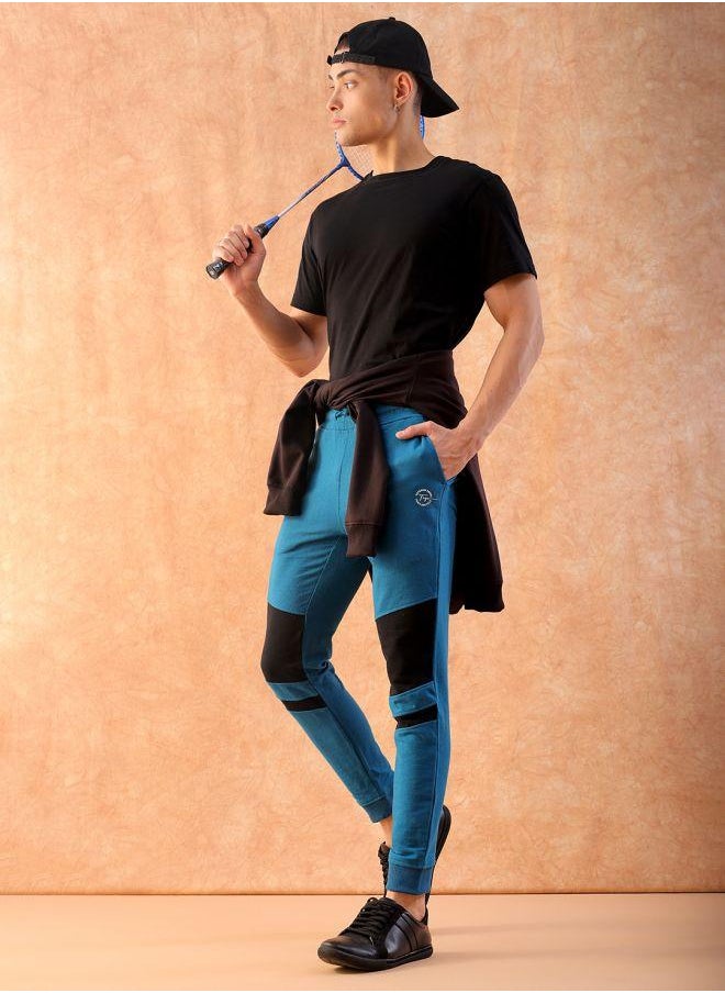 Men Slim Fit Solid Mid-Rise Stretchable Knitted Jogger Trousers