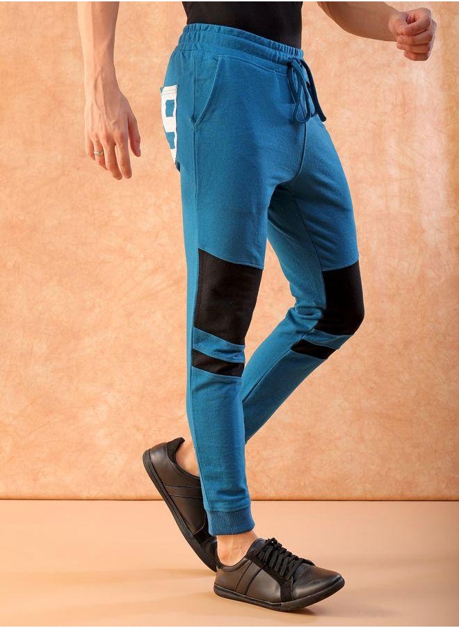 Men Slim Fit Solid Mid-Rise Stretchable Knitted Jogger Trousers