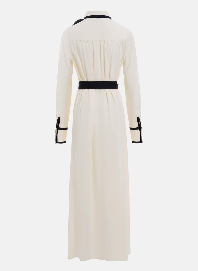 Maxi dress with contrasting inserts and flower brooch